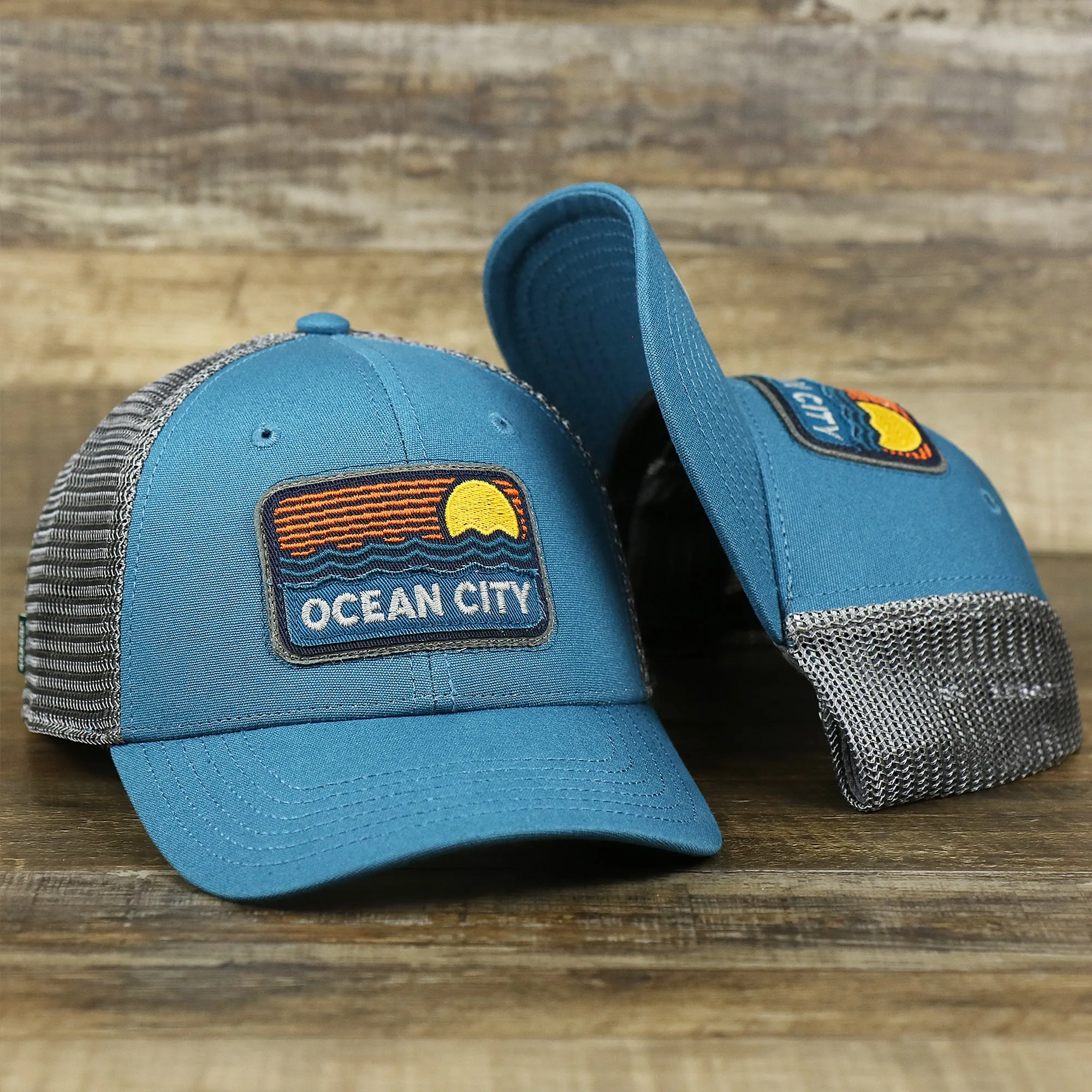 Youth New Jersey Ocean City Sunset Mesh Back Trucker Hat | Marine Blue And Dark Gray Mesh Youth Trucker Hat